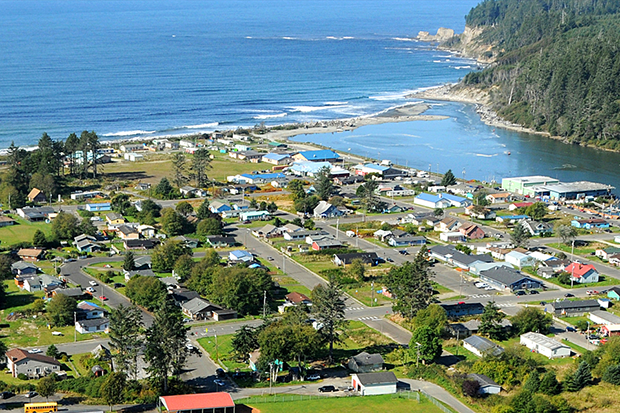 Aerial photo of the village of Taholah with the Pacific Ocean in the background
