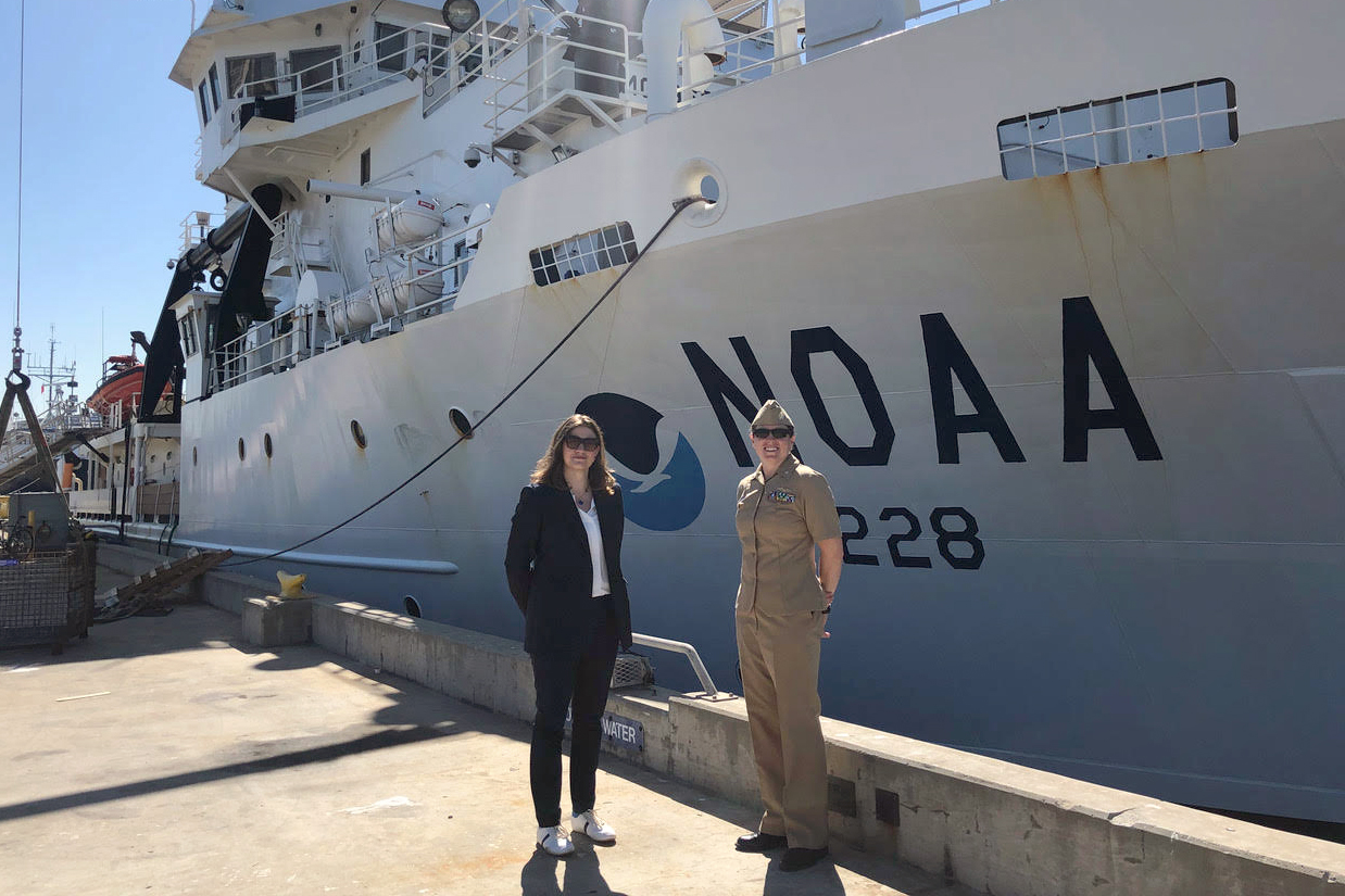 Kapnick in front of NOAA research ship 