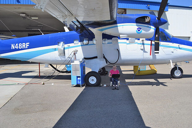 Dr. Ann Middlebrook next to aircraft