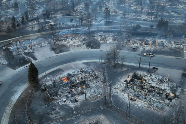 Photo of smoldering homes in Louisville, CO