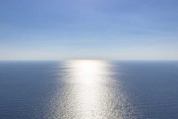 Sunlight reflection on smooth ocean surface