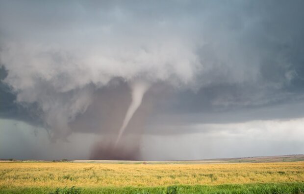 Tornado over open field
