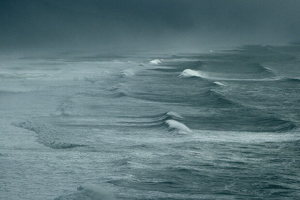 Ocean waves and cloudy sky