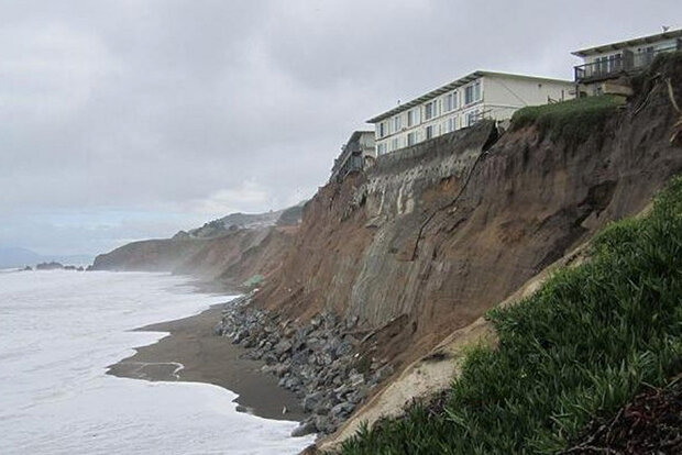 Building just above eroded cliff