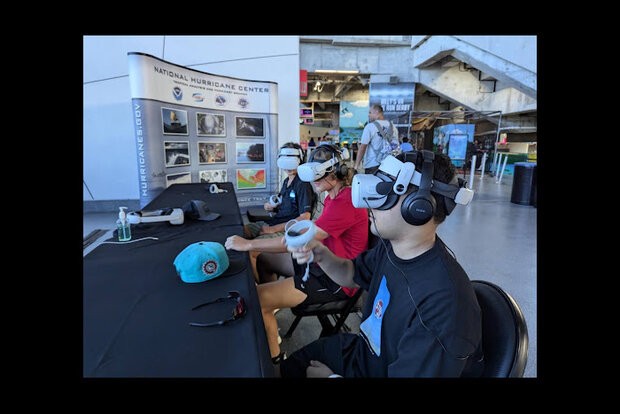 People wearing virtual reality headsets