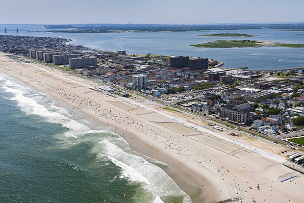 Aerial photo of narrow shoreline and buildings