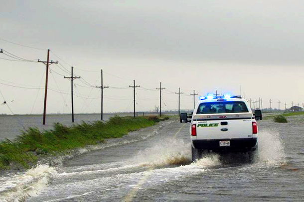 vehicles on a flooded stretch of LA Highway 1