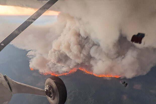 Airplane view above a burning fire